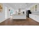 Bright kitchen features a spacious island, modern appliances, and plenty of cabinet storage at 16086 Johns Lake Overlook Dr, Winter Garden, FL 34787