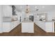 Bright, spacious kitchen featuring a center island and modern appliances at 16086 Johns Lake Overlook Dr, Winter Garden, FL 34787