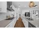 Modern kitchen with stainless steel appliances, quartz countertops, and ample storage space at 16086 Johns Lake Overlook Dr, Winter Garden, FL 34787