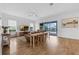 Bright living room with wood floors, patio access, and comfortable seating for entertaining guests at 16086 Johns Lake Overlook Dr, Winter Garden, FL 34787