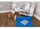 Bright main bedroom features hardwood floors, tray ceilings and natural light reflected in mirror at 16086 Johns Lake Overlook Dr, Winter Garden, FL 34787