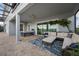Spacious outdoor patio with a dining table and comfortable cushioned seating at 16086 Johns Lake Overlook Dr, Winter Garden, FL 34787