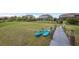Waterfront property featuring kayaks by the dock, ready for lakeside adventures and recreation at 16086 Johns Lake Overlook Dr, Winter Garden, FL 34787