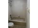 A clean bathroom features a standard tub, shower, and toilet with tiled walls at 2143 Autumn View Dr, Orlando, FL 32825