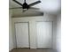 Bright bedroom features two closet spaces and ceiling fan at 2143 Autumn View Dr, Orlando, FL 32825