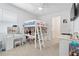 Spacious bedroom with a loft bed, a vanity, and a view into an open doorway at 2227 Blue Salvia St, Clermont, FL 34711