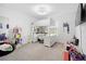 Bright bedroom with a loft bed, desk, and ample storage, perfect for a space at 2227 Blue Salvia St, Clermont, FL 34711