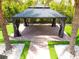 Overhead view of a backyard gazebo with a brick patio, curtains, and palm trees at 2227 Blue Salvia St, Clermont, FL 34711