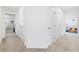 Hallway with neutral carpet and view of the playroom at 2227 Blue Salvia St, Clermont, FL 34711