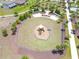 Aerial view of a community playground featuring modern equipment and well-maintained landscaping at 2227 Blue Salvia St, Clermont, FL 34711