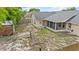 Backyard view showing the screened-in porch, fence, and trees at 2311 Alton Rd, Deltona, FL 32738