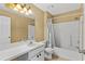 Standard bathroom with a shower and tub combo, a vanity, and a toilet at 2311 Alton Rd, Deltona, FL 32738