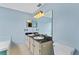 Bathroom boasts dual sinks, vanities, and mirrors at 2311 Alton Rd, Deltona, FL 32738
