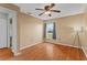 Cozy bedroom with a ceiling fan, a window, and hardwood floors at 2311 Alton Rd, Deltona, FL 32738
