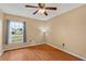 Well-lit bedroom with hardwood floors and large window for lots of natural light at 2311 Alton Rd, Deltona, FL 32738