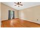 Bedroom features a ceiling fan, wood floor and window at 2311 Alton Rd, Deltona, FL 32738