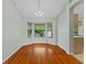 Bright dining area with hardwood floors and a bay window offering a backyard view at 2311 Alton Rd, Deltona, FL 32738