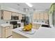 Well-equipped kitchen boasts stainless steel appliances, stone countertops, and a large island at 2311 Alton Rd, Deltona, FL 32738
