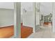 Open-concept living room showcases wood flooring and architectural columns at 2311 Alton Rd, Deltona, FL 32738