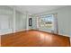Cozy living room boasting hardwood floors and a large window, bathing the room in natural light at 2311 Alton Rd, Deltona, FL 32738