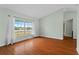 Bright living room features wood floors, large windows, and natural light at 2311 Alton Rd, Deltona, FL 32738