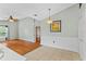 Bright living room connects to a dining room with vaulted ceiling and attractive light fixture at 2311 Alton Rd, Deltona, FL 32738