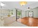 The living room and kitchen share an open layout with a sliding glass door to the back patio at 2311 Alton Rd, Deltona, FL 32738