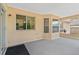Covered patio with a neutral stucco wall and concrete floors at 2311 Alton Rd, Deltona, FL 32738