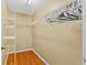 Bright walk-in closet with wooden floors, shelving, and space for organized storage at 2311 Alton Rd, Deltona, FL 32738