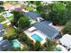Aerial view of a home with a private pool, patio, and lush landscaping in a desirable neighborhood at 2318 Mohawk Trl, Maitland, FL 32751