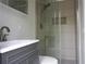 Stylishly remodeled bathroom featuring a glass-enclosed shower with modern fixtures at 2318 Mohawk Trl, Maitland, FL 32751