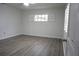 Bright bedroom with modern vinyl floors, closet and window with plantation shutters at 2318 Mohawk Trl, Maitland, FL 32751