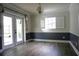 Cozy dining room featuring new floors, large windows, and modern lighting at 2318 Mohawk Trl, Maitland, FL 32751