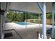 Inviting backyard pool area with brick pavers and a covered patio perfect for outdoor relaxation at 2318 Mohawk Trl, Maitland, FL 32751
