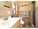 Bathroom showcasing tiled walls, a modern sink, and a glass door shower at 2810 Nancy St, Orlando, FL 32806