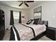 Bedroom featuring neutral walls, ceiling fan, and dark curtains and accents at 2810 Nancy St, Orlando, FL 32806