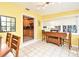 Bright breakfast nook area featuring tile flooring, natural light, and access to the kitchen at 2810 Nancy St, Orlando, FL 32806