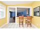 Breakfast nook featuring tile flooring and a bar looking into a living room area at 2810 Nancy St, Orlando, FL 32806