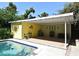 Inviting pool area featuring a covered lanai, perfect for outdoor lounging and entertaining at 2810 Nancy St, Orlando, FL 32806