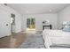 Bright main bedroom features neutral tones, a private patio, and LVP flooring at 309 N Kepler Rd, Deland, FL 32724