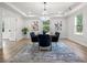 Elegant dining room with modern chandelier, natural light, and seamless flow to other spaces at 309 N Kepler Rd, Deland, FL 32724
