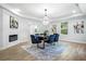 Open dining room featuring modern lighting, stylish decor, and luxury vinyl plank flooring at 309 N Kepler Rd, Deland, FL 32724
