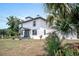 Charming two-story home with a well-manicured lawn and beautiful landscaping at 309 N Kepler Rd, Deland, FL 32724
