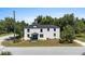 Charming two-story home with a well-manicured lawn and beautiful landscaping at 309 N Kepler Rd, Deland, FL 32724