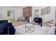 Contemporary living room features sleek fireplace accent wall and stylish furniture at 309 N Kepler Rd, Deland, FL 32724
