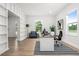 Home office features built-in shelves, neutral decor, and bright natural light at 309 N Kepler Rd, Deland, FL 32724