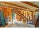 Unfinished storage shed interior with open beams, plywood walls and staircase at 309 N Kepler Rd, Deland, FL 32724