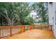 View of spacious wooden deck featuring wood railings perfect for outdoor entertaining at 309 N Kepler Rd, Deland, FL 32724