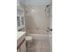Standard bathroom with tiled shower-tub combination and vanity with sink and storage at 3124 S Semoran Blvd # 206, Orlando, FL 32822