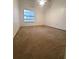 Neutral bedroom with carpeting, a ceiling fan, and plenty of natural light from the window at 3124 S Semoran Blvd # 206, Orlando, FL 32822